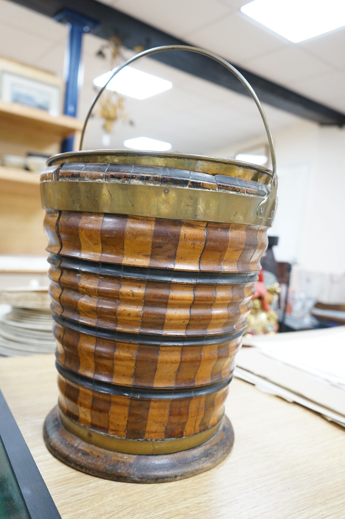 A 19th century Dutch marquetry oyster bucket with swing handle, 33cm high. Condition - fair